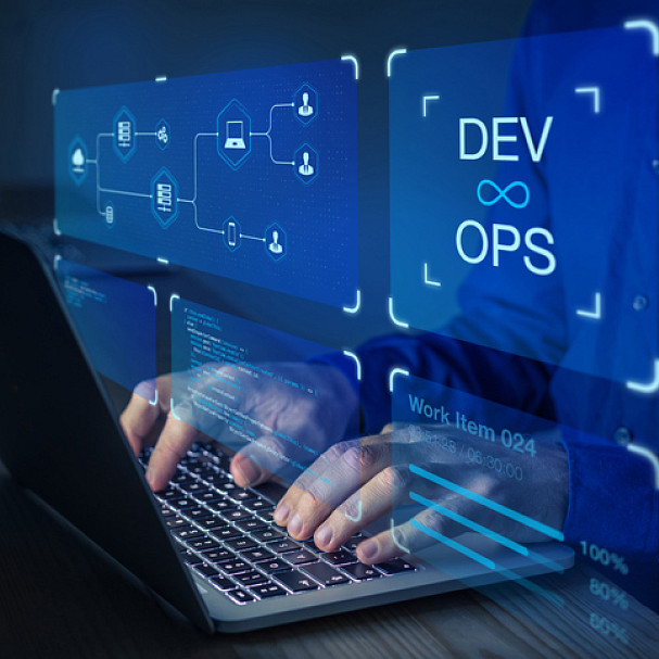 man working on computer in devops