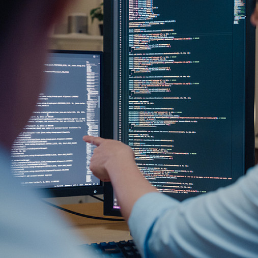 production support worker looking at computer screen