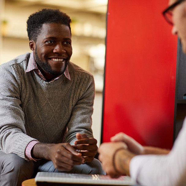 two coworkers discussing the skills gap