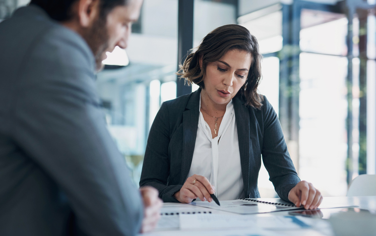 woman looking through cover letter