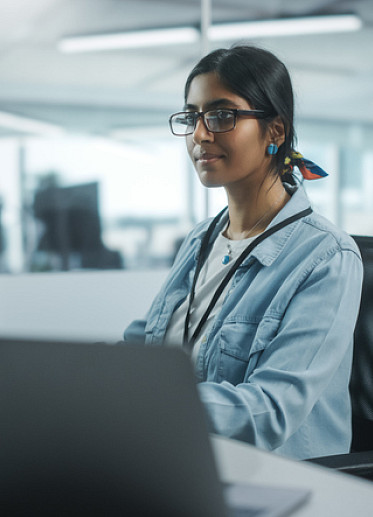 young woman working in tech office