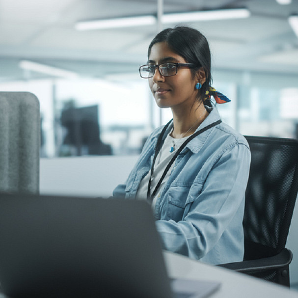 young woman working in tech office