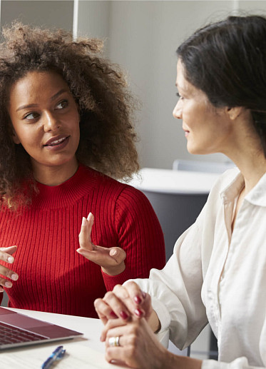 cowokers talking to each other about burnout