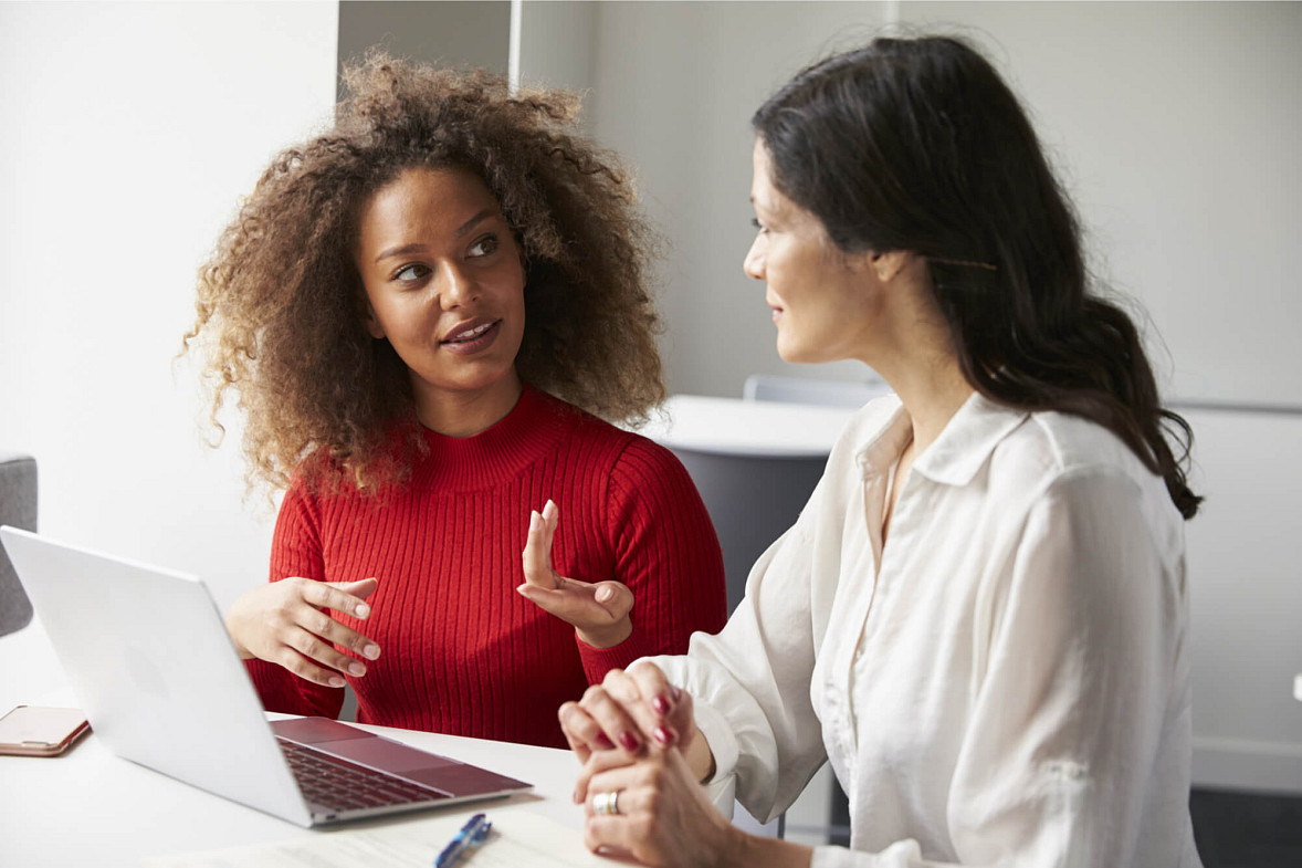 coworkers talking to each other about burnout