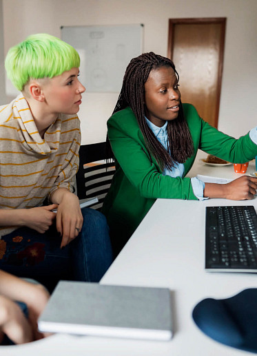 Group of Women Looking at Monitor