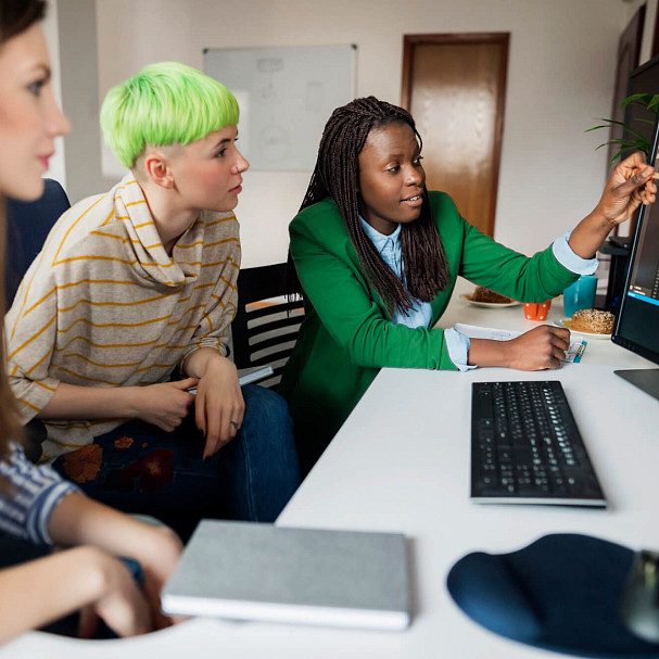 Group of Women Looking at Monitor