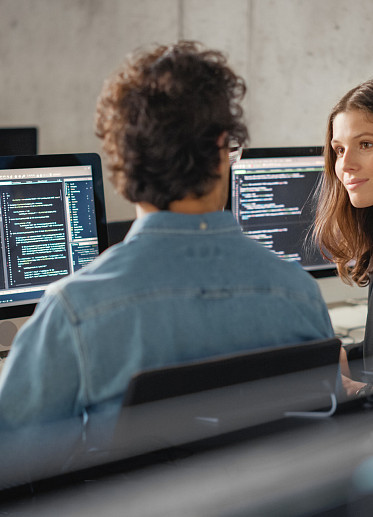 coworkers discussing tech jargon