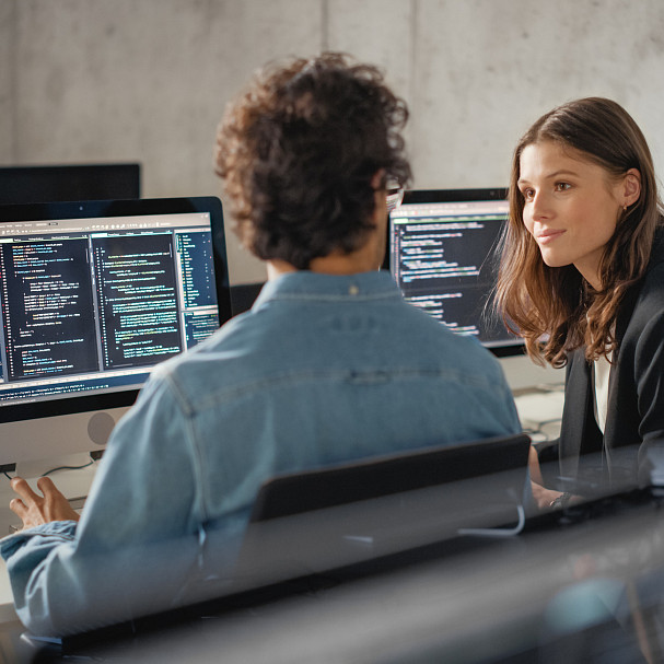 coworkers discussing tech jargon