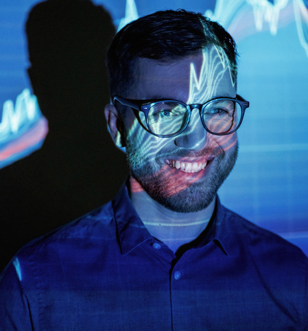 man smiling with growth graphic