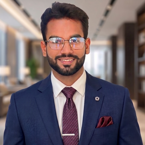 headshot of Akash with a blurred office background